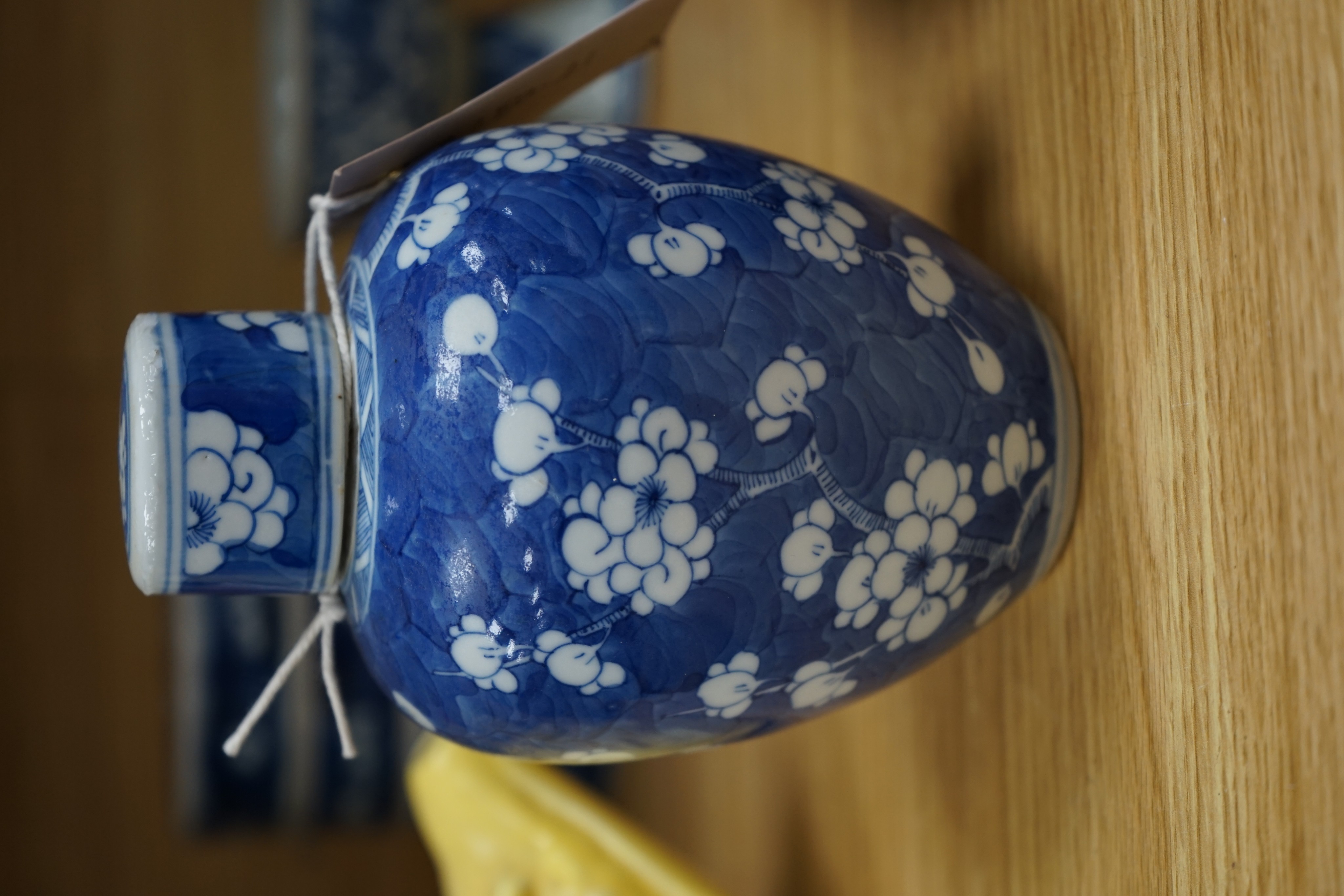 A Chinese blue and white ovoid jar and cover and similar stacking box, Kangxi and a Qing blue and white footed cup, tallest 15cm